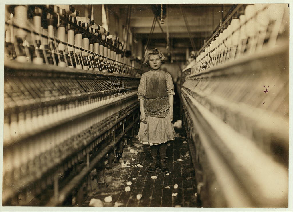 Little spinner in Globe Cotton Mill, Augusta, Ga. Overseer said she was regularly employed. Location: Augusta, Georgia. Photo by Lewis Wickes Hine,1909 January. https://hdl.loc.gov/loc.pnp/nclc.01641